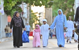 Children in their special Eid clothes attend today's prayers.-- Photo: Nishan Ali / Mihaaru