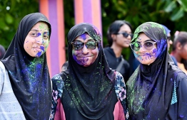 Posing for a pic, covered in colours.-- Photo: Nishan Ali / Mihaaru