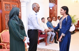 President Dr Muizzu and First Lady Sajida greet a member of the public.-- Photo: President's Office