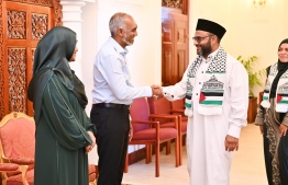 President Dr Muizzu and First Lady Sajida greet Minister of Islamic Affairs Dr Mohamed Shaheem Ali Saeed.-- Photo: President's Office