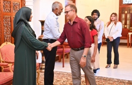 President Dr Muizzu and First Lady Sajida greet Minister of Cities, Local Government and Public Works Adam Shareef Umar and Family.-- Photo: President's Office