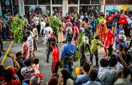 Hundreds of people gathered to watch the traditional parade on Eid day.-- Photo: Nishan Ali / Mihaaru