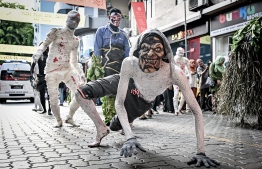 'Maali' in full performance in the procession.-- Photo: Nishan Ali / Mihaaru