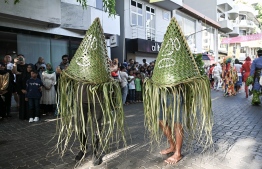 Two 'Maali' in costumes woven out of coconut palm fronds.-- Photo: Nishan Ali / Mihaaru