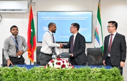 MD of Fenaka Corporation, Muaz Mohamed Rasheed with the Vice President of Dongfeng Electric Machinery Co., Ltd. -- Photo: Nishan Ali / Mihaaru