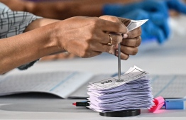 Storing queue numbers after voters cast their vote in the elections. -- Photo: Fayaz Moosa / Mihaaru News