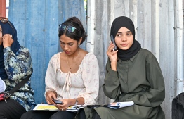 Observers waiting at the polling station; A large number of observers will be active during this election scene. -- Photo: Fayaz Moosa / Mihaaru News