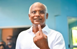 Former President Ibrahim Mohamed Solih showing his finger marked with election ink after casting his vote at the elections today. -- Photo: Fayaz Moosa / Mihaaru News