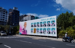 A campaign poster sporting parliamentary election candidates of the ruling party, PNC.