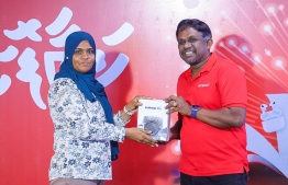 Huawei P10 smart watch being gifted during the ceremony held by Ooredoo. -- Photo: Fayaz Moosa / Mihaaru News