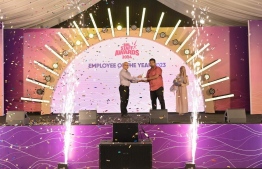 A BML employee being presented an award at the awarding ceremony held Friday night.
