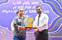 Presenting the first place winner of the Quran and Azan Compeition, Thakmeen Hussain with his prizes. -- Photo: Fayaz Moosa / Mihaaru News