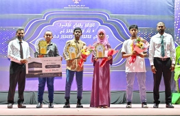 Managing Director of Maldives Hajj Corporation, Mohamed Shakeel and Deputy Managing Director of the Corporation, Mohamed Shihab with the four winners of the Quran Compeition held by Himmafushi at the awarding ceremony. -- Photo: Fayaz Moosa / Mihaaru News