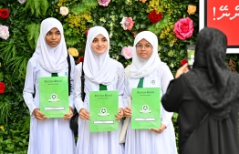 Students of Ameeniya School holding their report forms after the conclusion of the 2023 academic school year today. -- Photo: Nishan Ali / Mihaaru News