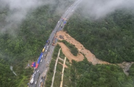 This photo taken on May 1, 2024 shows an aerial view of a collapsed section of a highway near Meizhou, in southern China’s Guangdong province. At least 36 people died after part of a highway collapsed due to heavy rain on May 1, state media said. -- Photo: CNS/ AFP
