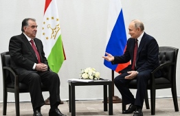 Russian President Vladimir Putin (R) speaks to Tajik President Emomali Rahmon during their talks in Kazan, the capital of the Republic of Tatarstan, Russia -- Photo: Almayadeen