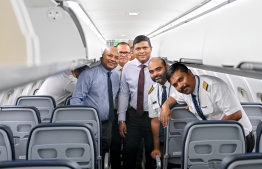 The crew of the fourth ATR aircraft of Maldivian Aero posing with the Minister of Transport and Civil Aviation Mohamed Ameen and Minister of Cities, Local Governance and Public Works Adam Shareef Umar. -- Photo: Nishan Ali / Mihaaru News