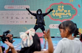 A child participating in an activity hosted featured at the 'Ufaa Festival' held on Friday inside Hulhumale Central Park to commemorate the national Children's Day. -- Photo: Nishan Ali |Mihaaru News
