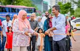 Minister of Social and Family Development, Dr Aishath Shiham and Managing Director of Housing Development Corporation (HDC) Ibrahim Fazul Rasheed cutting the ribbon to officially open the 'Ufaa Festival' held at Hulhumale Central Park to commemorate the national Children's Day. -- Photo: Nishan Ali |Mihaaru News