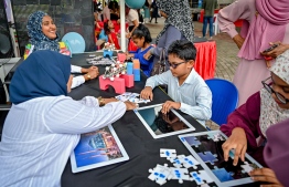 Children participating in an entertainment activity featured at a stall during the 'Ufaa Festival' held on Friday inside Hulhumale Central Park to commemorate the national Children's Day. -- Photo: Nishan Ali |Mihaaru News