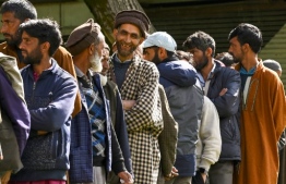 Men queue up to cast their ballots at a polling station during the fourth phase of voting in India’s general election, in Ganderbal on May 13, 2024. -- Photo: Tauseef Mustafa