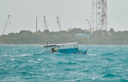 [FILE] a vessel travelling near capital city Male' on a rainy day -- Photo: Fayaz Moosa