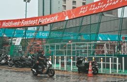 Metal fence around Maafaanu Futsal Stadium collapses under the rough weather conditions.-- Photo: Nishan Ali / Mihaaru