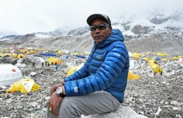 (FILES) In this photograph taken on May 2, 2021, Nepali mountaineer Kami Rita Sherpa poses during an interview with AFP at Everest base camp in the Mount Everest region of Solukhumbu district. Nepali climber Kami Rita Sherpa broke his own record May 22, 2024 as the person to have scaled Mount Everest the most times, achieving the milestone 30th ascent of the world's highest peak. The 54-year-old, known as "Everest Man", reached the summit for the 29th time earlier this month, before climbing to the top again. -- Photo: Prakash Mathema / AFP