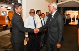 President Dr Mohamed Muizzu shaking hands with the Vice President, Hussain Mohamed Latheef before departing for Antigua and Barbuda to attends the SIDS4 last night. -- Photo: President's Office