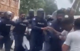 [File] Still shot from the altercation between police and locals on Narudhoo island while attempting to execute a child custody order --