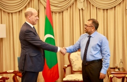 The Ambassador of France to Sri Lanka and Maldives, Jean-François Pactet (L) shaking hands with Maldives' Minister for Foreign Affairs, Moosa Zameer (R). -- Photo: Foreign Ministry