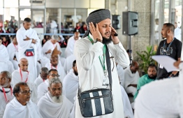 Pilgrims of the first Maldivian Hajj group performing the Friday prayer in congregation at the Velana International Airport (VIA) on Friday before their departure to Saudi Arabia for Hajj. -- Photo: Nishan Ali / Mihaaru News