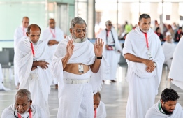 Pilgrims of the first Maldivian Hajj group performing the Dhuhr (midday) prayer in congregation at the Velana International Airport (VIA) on Friday before their departure to Saudi Arabia for Hajj. -- Photo: Nishan Ali / Mihaaru News