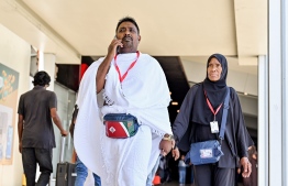 Two pilgrims of the first Hajj group departing from Maldives at the Velana International Airport (VIA) on Friday before their departure to Saudi Arabia for Hajj. -- Photo: Nishan Ali / Mihaaru News