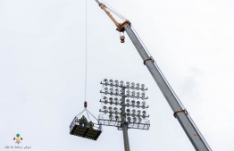 Ongoing repairs of a lighting system at Galolhu National Stadium. -- Photo: Ministry of Sports, Fitness and Recreation.