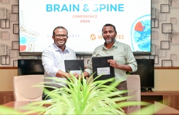 Posing for a photo after signing the agreement for diamond partnership of the Brain and Spain conference. -- Photo: Nishan Ali / Mihaaru News