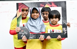 Children pose for a photo during "Palestine aa eku Dhivehin," telethon, organized by state media, Public Service Media (PSM) -- Photo: Nishan Ali