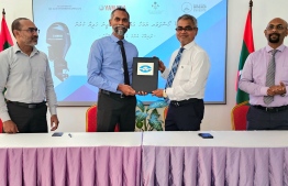Managing Director of ALIA, Alau Ali delivering the engine to Minister of Climate Change, Environment and Energy, Thoriq Ibrahim.