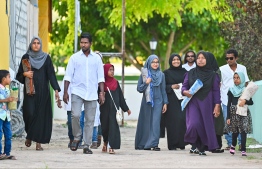 People heading to the B. Kendhoo football stadium to join the Eid-al-Adha prayer congregation today. -- Photo: Fayaz Moosa / Mihaaru News