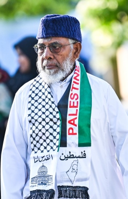 A man who joined the large Eid-al-Adha prayer congregation at the B. Kendhoo football stadium today wearing a scarf in solidarity with Palestine. -- Photo: Fayaz Moosa / Mihaaru New