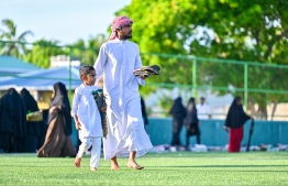 People heading to the B. Kendhoo football stadium to join the Eid-al-Adha prayer congregation today. -- Photo: Fayaz Moosa / Mihaaru News