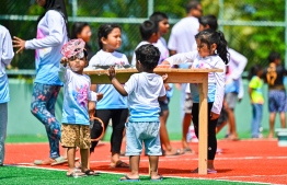 A child blowing bubbles at the Bubble Show held for children in Baa Kendhoo Volleyball Court. -- Photo: Fayaz Moosa / Mihaaru News