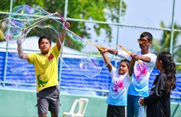 Children blowing bubbles at the Bubble Show held for children in Baa Kendhoo Volleyball Court to colorfully celebrate Eid-al-Adha festivities. -- Photo: Fayaz Moosa / Mihaaru News