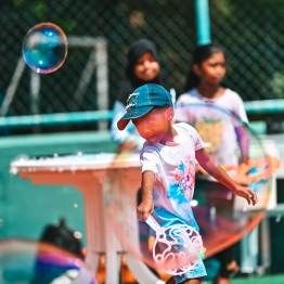 A child blowing bubbles at the Bubble Show held for children in Baa Kendhoo Volleyball Court to colorfully celebrate Eid-al-Adha festivities. -- Photo: Fayaz Moosa / Mihaaru News