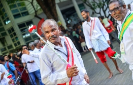 A group from Vaavu atoll Keyodhoo performing a special traditional activity for Eid-al-Adha yesterday at the four way intersection of Majeedhee Magu and Sosun Magu. -- Photo: Mihaaru News