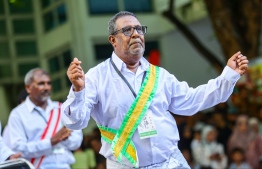 A group from Vaavu atoll Keyodhoo performing a special traditional activity for Eid-al-Adha yesterday at the four way intersection of Majeedhee Magu and Sosun Magu. -- Photo: Mihaaru News