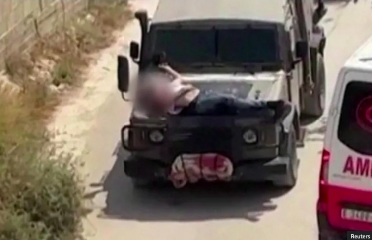 ފަލަސްތީނު މީހަކު ވެހިކަލެއްގެ ބޮނެޓް މަތީ އައްސާފައި!