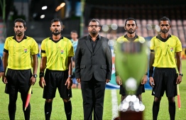 Referees of the final match of the U19 Youth Championships posing for a photo with the Commissioner of the match before the finals begins. -- Photo: Fayaz Moosa / Mihaaru News