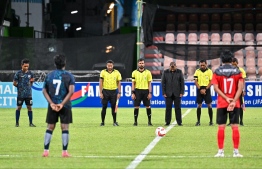 Officials and players of the U19 Youth Championship 2024 finals undertaking a minute of silence held in tribute for the late former defensive midfielder of the Maldives National team, Mohamed Arif (Baka) prior to the start of the match. -- Photo: Fayaz Moosa / Mihaaru News