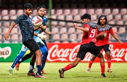 A player of Super United Sports steering the ball towards TC Sports Club's defensive area. -- Photo: Fayaz Moosa / Mihaaru News